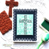 Card with the word-art cross in aqua framed by a navy scalloped die over a doily.