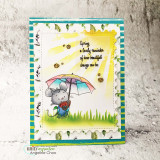Sunburst card of the mouse under a rainbow umbrella in green grass with the spring change quote.