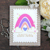 Card with a bright pink-and-purple rainbow over clouds, 'hope your birthday is full of sunshine and rainbows.'