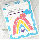 Card with a pink-and-yellow rainbow over a fluffy cloud on a blue sky panel.