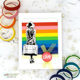 Rainbow-striped card with the traveler and a 'LOVE' badge.