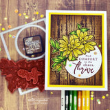 Woodgrain card with a yellow border, hand colored golden dahlias and green leaves, and a white circle reading Find COMFORT in the chaos. thrive.