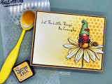 Yellow honeycomb card with the gnome in a green hat on a white daisy, over 'Let The Little Things Be Enough.'