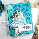Teal card with the girl in a purple dress by a blue heart cake, 'It's your birthday, go celebrate girl.'