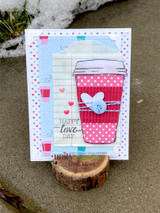Handmade card featuring the floral and plain to-go coffee cups, glowing on a sunburst background, stamped with 'Hello Beauty'.