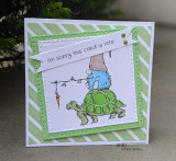 Green striped card of the gnome riding the turtle with 'I'm sorry this card is late.'