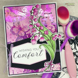 Pink mixed-media card with the lily of the valley and a butterfly and 'Wishing you Comfort.'