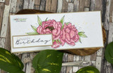 Slimline card of soft pink peonies with a 'Happy Birthday' banner.