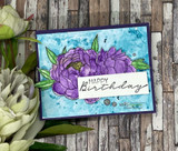 Card of purple peonies on a blue watercolor wash, 'Happy Birthday.'