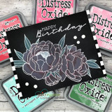 Peony-stenciled card on black with 'Happy Birthday' made with Distress Oxide inks.