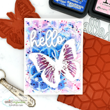 The butterfly in purple and white on a blue mixed-media card.