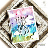 Rainbow blended card stamped all over with the nested arch pattern, with white die cut letters spelling THANK YOU and small cloud accents.