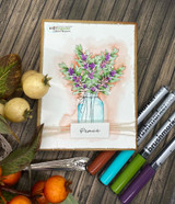 Card of a jar of purple blooms and olive leaves, 'Peace.'