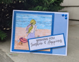Beach girl in a lilac suit on a blue plank background with a gingham panel and layered sentiment.