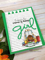 Green card pairing the notebook-paper look with a cozy girl reading by a fireplace and a die-cut 'girl' word, 'Embrace the seasons of change.'