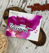 Magenta alcohol-ink card with Happy Retirement in a scripted banner.