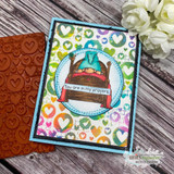 Heart-print card with the gnome in bed on a blue circle and 'You are in my prayers.'