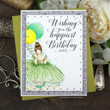 Card with a girl in a flowing green gown holding balloons, framed in silver pearls under 'Wishing you the happiest Birthday ever.'