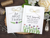 Two clean white cards with tiny stamped flowers and twine bows, lettered 'Just a little note to say Thank you' and 'With Sympathy.'