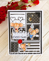 Two mice on black-and-white patchwork papers, 'happy everything.'