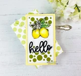 Two lemons with blossoms on a green polka-dot card, finished with a "Hello" word.