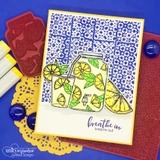 A jar of lemonade with lemon slices on a blue-tile-stamped card, captioned "Breathe in, breathe out."