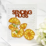 Die-cut lemon slices with a "Sending hugs" word on a white embossed card.