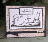 Handmade Halloween card with a witch stirring a bubbling cauldron beside a spooky graveyard scene, sentiment 'This is Halloween'.