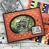Toil and Trouble card, the witch, cat-on-pumpkin and gnarled graveyard colored in oranges and greens, 'Double double toil and trouble'.
