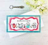 Teal card with a hot pink die cut frame and a slimline panel of hand coloured teapots and kettles, stamped 'Let's catch up over a cuppa tea'.