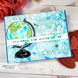 Handmade card made with Unity Stamp Co’s Topography Background red rubber background stamp — a full A2 background stamp of topographic contour-map lines — layered behind the focal images and sentiment on this card.