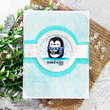 Card of the tin tile background in soft blue with a penguin, 'WARM hugs'.