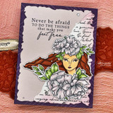 Card with a woman wearing flowers in her hair and 'never be afraid to do the things that make you feel free.'