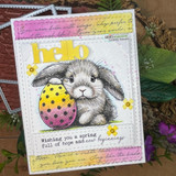 Spring card with a gray bunny holding an Easter egg, 'hello,' over the soft script panel.