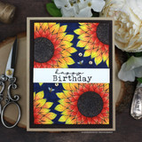 Card with two bold red-and-yellow sunflowers on navy, 'happy Birthday.'