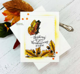 Card with an amber butterfly and 'thinking of you this Thanksgiving season.'
