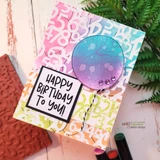 Pastel rainbow card with the number background stamped over pink and orange blending, and a panel reading Happy birthday to you.