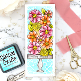 Slimline card with a coral and pink flower tower on a cake pedestal over an aqua crackle panel, banded with the sentiment 'YOU TAKE THE CAKE'.