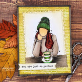 The girl in a green knit hat with her striped mug, matted on a script-print panel among fall leaves — 'you are just so perfect.'