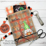Mixed-media treat bag with a green gnome and 'Happy Halloween.'