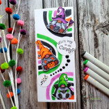 Slimline card with colorful Halloween gnomes on a retro swirl background, 'Witch way to the candy?'