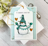 Card of the snowman with mittens and a banner on soft teal, 'IT'S A WONDERFUL TIME OF YEAR!'