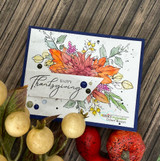 Coral and orange autumn bouquet on a white panel over navy with the sentiment 'Happy Thanksgiving'