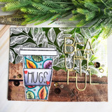 Card with the leafy coffee cup on a woodgrain panel with a die-cut 'beautiful.'