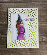 Card with the witch in a purple dress on a green polka-dot panel, 'Happy Halloween brew-tiful.'