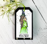 Gift tag with the witch in a green dress, 'Happy Halloween brew-tiful.'