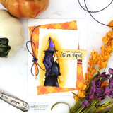 Card with the witch on an orange harlequin panel among fall florals, 'Happy Halloween brew-tiful.'