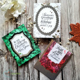 Card with a leafy green wreath frame around a 'We wish you a Merry Christmas & a happy New Year' sentiment.
