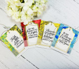 Set of hanging gift tags stamped with the various holiday sentiments in mixed colors.