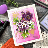Hot pink card with deep purple anemones and bright green leaves, topped with a large die cut sending hugs greeting.